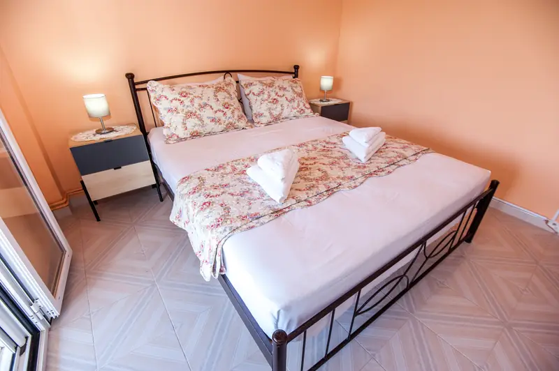The double bed, made up with fresh linen