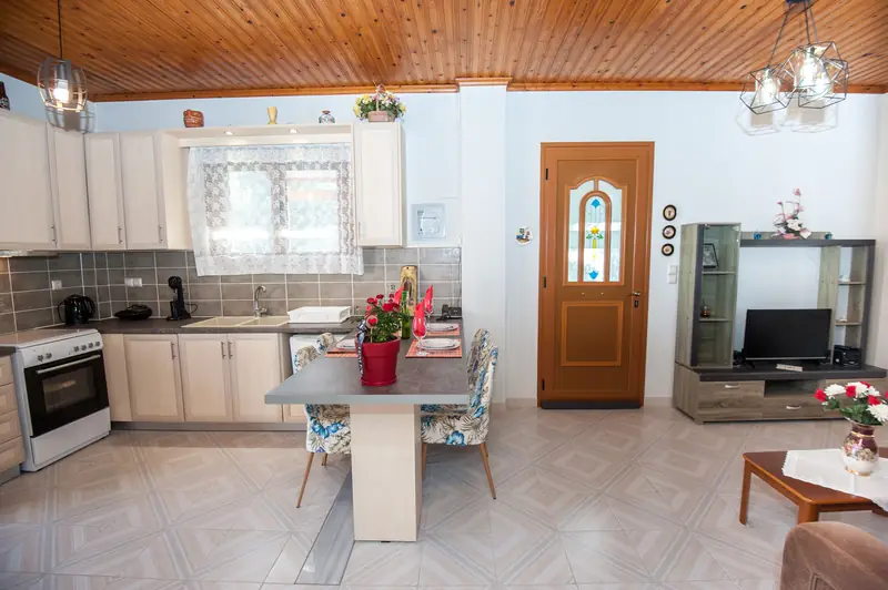 The dining area under the timber-panelled ceiling