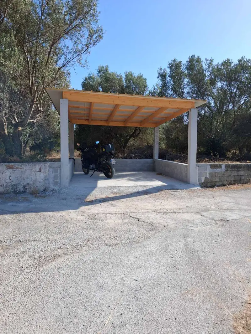 The parking area beside the house