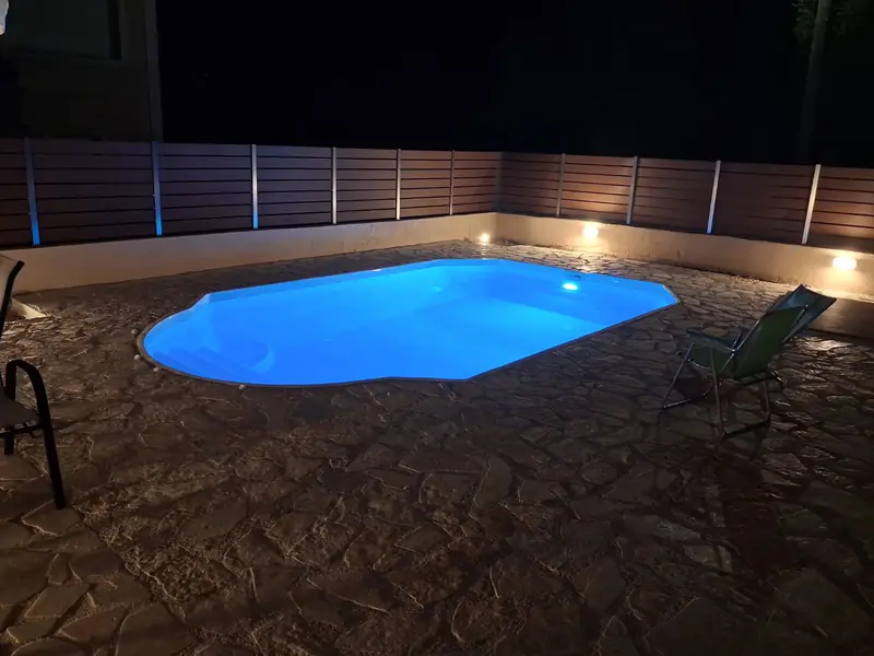 The pool on its stone-paved terrace